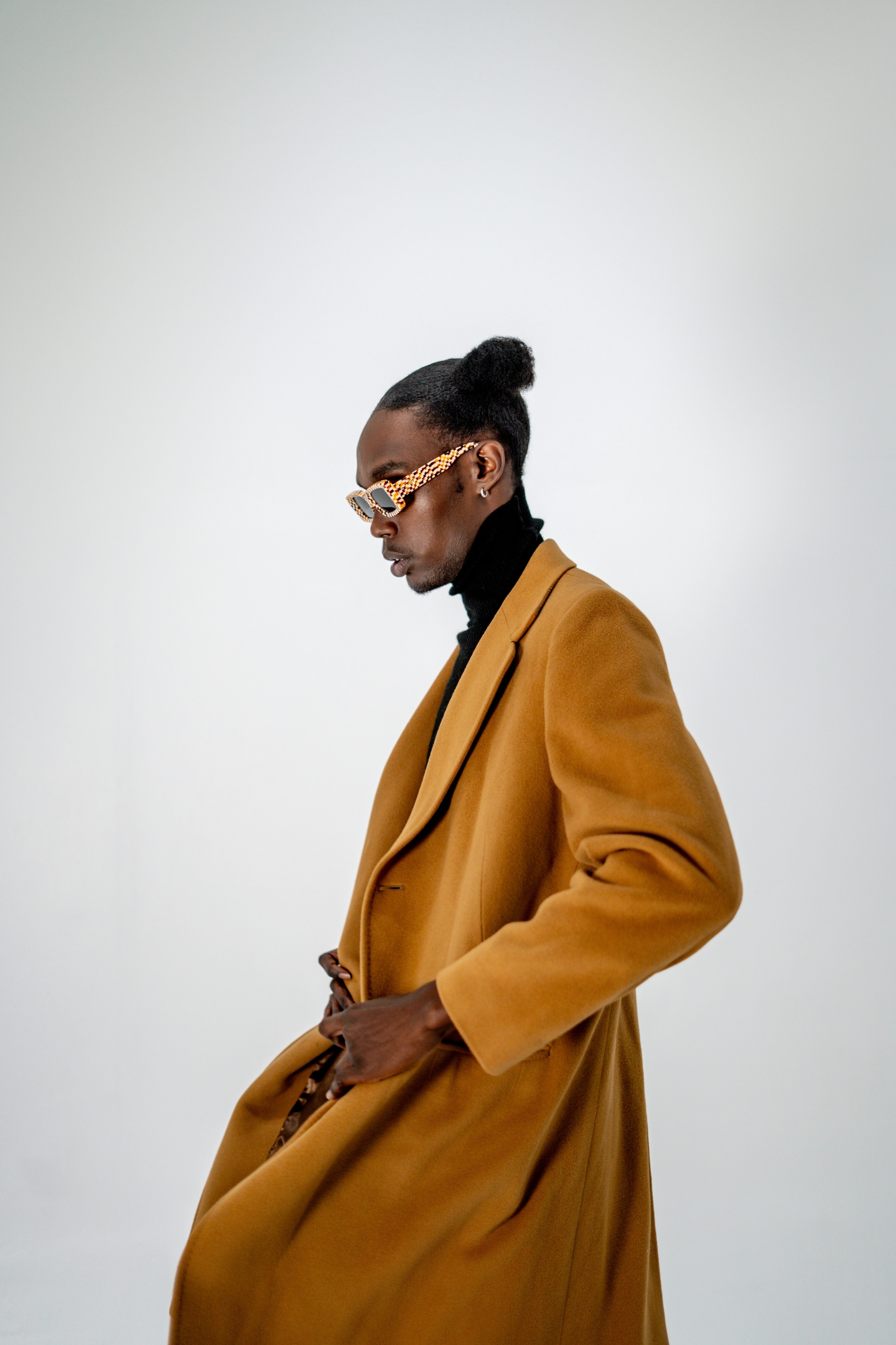 Model wearing Checkmate Orange unisex sunglasses – bold square frame